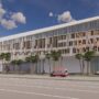 Rendering of the proposed North Bay Village municipal complex, featuring a modern façade, palm trees, and emergency vehicles.